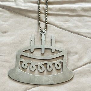 2/$20 Silver Tone Large birthday cake charm on short beaded chain